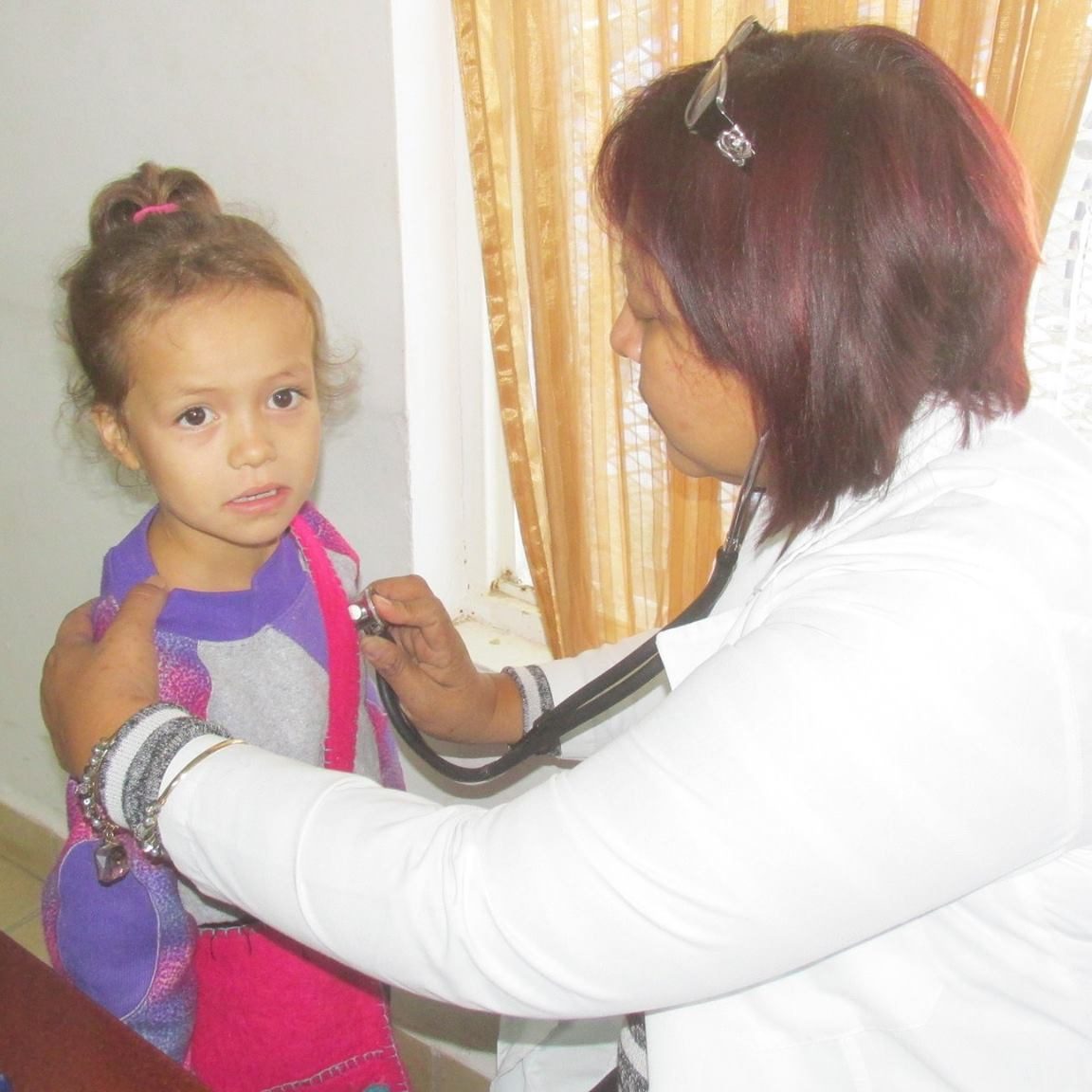Doctor examining  young patient.