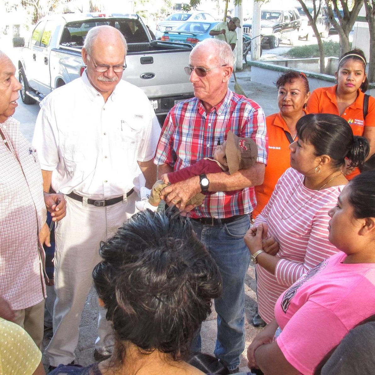 Dennis and ladies from La Puerta de Esperanza, a home for unwed pregnant teenage girls, are being greeted by George and Joe of AMO along with Maria Del Rosario and other DIF staff ready to help.