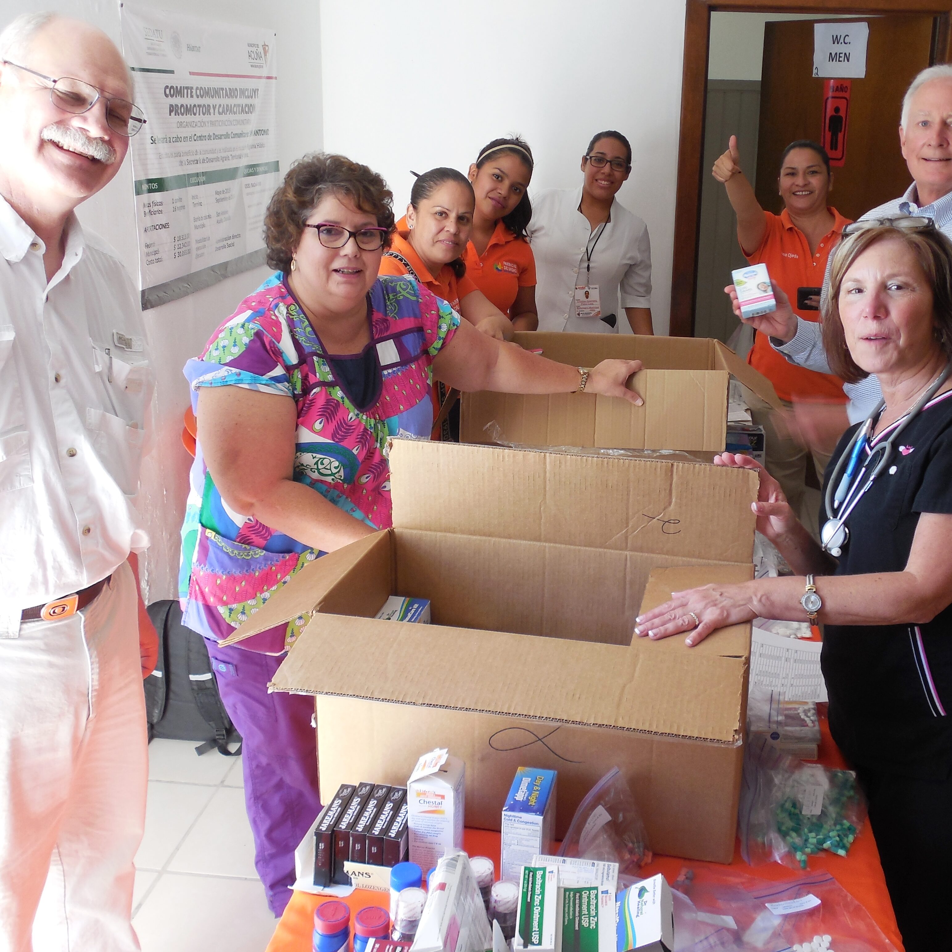 AMO volunteers Mindy, Skoshi, Joe and Dr. Johnson along with DIF staff setting up the pharmacy for medical clinic.  Medications made possible by generaour donations to AMO.